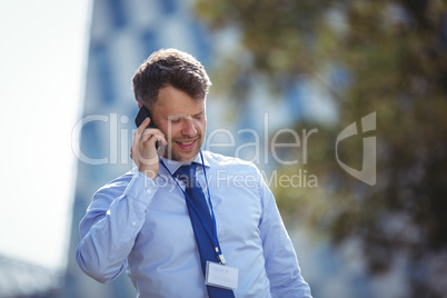 Handsome businessman talking on mobile phone