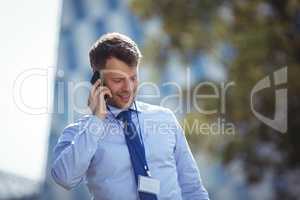 Handsome businessman talking on mobile phone