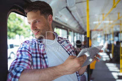 Handsome man using digital tablet