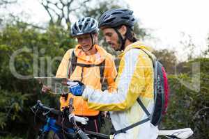 Biker couple looking at a map