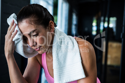 Female athlete wiping sweat
