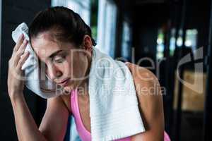 Female athlete wiping sweat