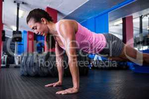 Athlete woman doing push-ups