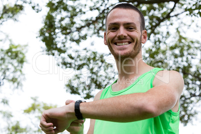 Man adjusting a time on wristwatch