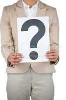 Businesswoman holding a question mark sign