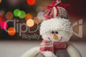 Close-up of snowman on wooden table