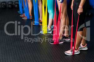 Athletes exercising with resistance band