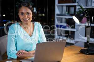 Businesswoman working on laptop