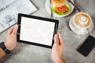 Hands of man holding digital tablet