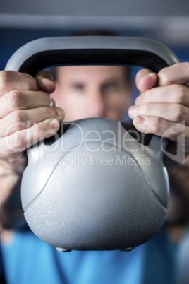 Man holding kettlebell