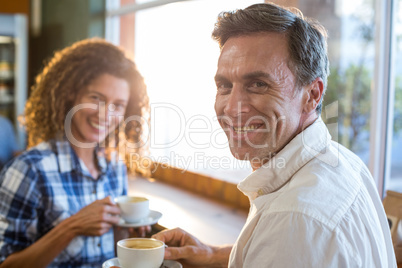 Couple having a cup of tea in supermarket