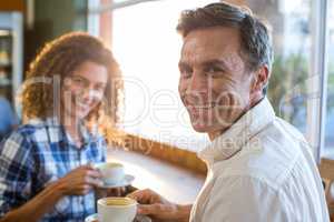 Couple having a cup of tea in supermarket