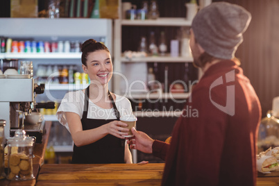 Waitress offering a cup of coffee