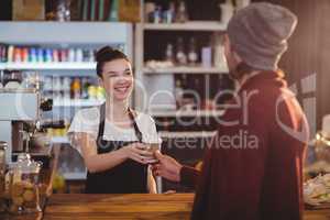 Waitress offering a cup of coffee