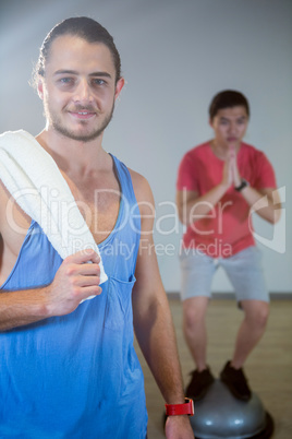 Fitness man standing in gym