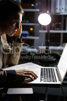 Businesswoman working on laptop