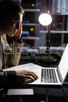 Businesswoman working on laptop