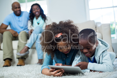 Children using digital tablet