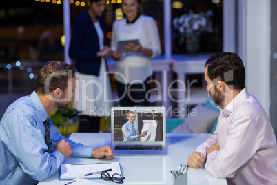 Businessmen having video conference