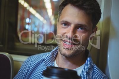 Portrait of man travelling in train