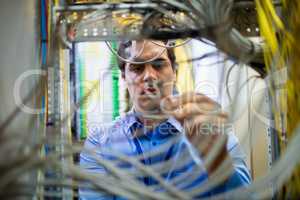 Technician fixing cable