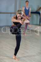 Woman performing stretching exercise