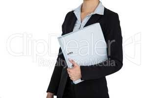 Businesswoman holding a file against white background