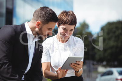 Businesspeople discussion on digital tablet