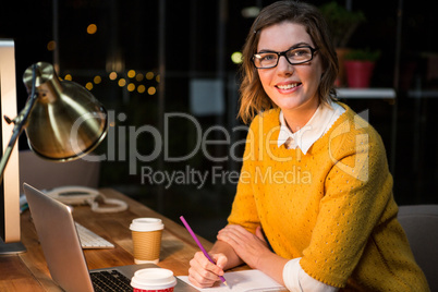 Businesswoman sitting at her desk