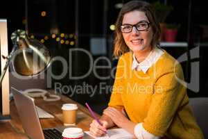 Businesswoman sitting at her desk