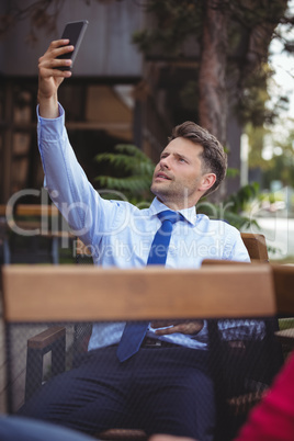 Businessman taking selfie