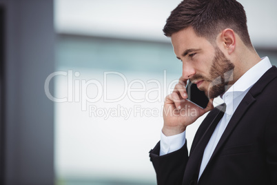 Businessman talking on mobile phone