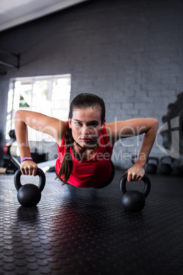 Portrait of confident athlete doing push-ups