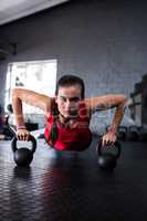 Portrait of confident athlete doing push-ups