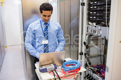 Technician working on laptop