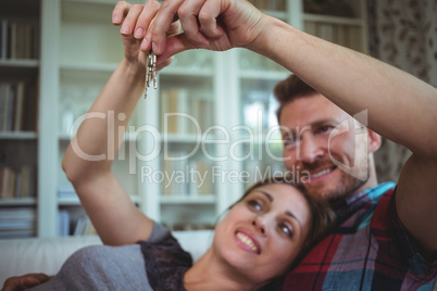 Happy couple holding their house key