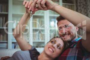Happy couple holding their house key