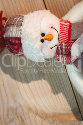 Close-up of snowman on wooden table