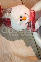 Close-up of snowman on wooden table