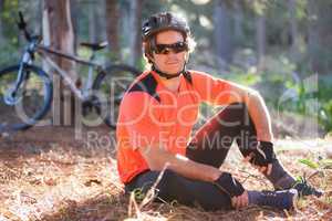 Portrait of male mountain biker in the forest