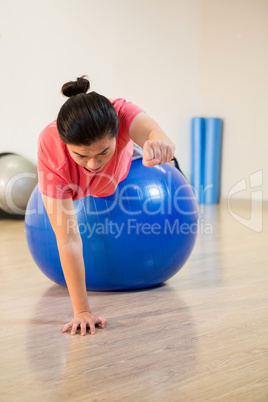 Men exercising on exercise ball