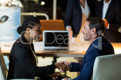 Businessman shaking hands with colleague