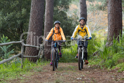 Biker couple cycling in countryside