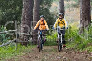 Biker couple cycling in countryside