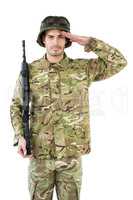 Portrait of soldier holding a rifle and saluting