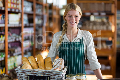 Female staff standing at bread counter