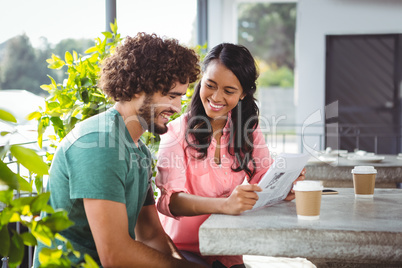 Couple holding menu card