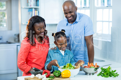 Happy family preparing food