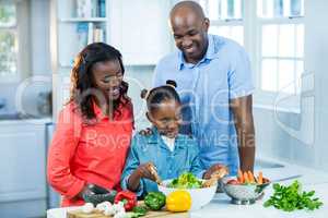 Happy family preparing food