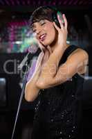 Woman singing in bar